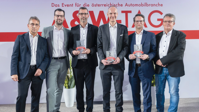  Drei Preisträger auf der Bühne