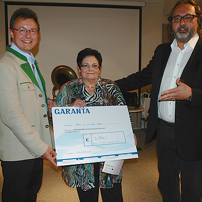  Scheck für guten Zweck